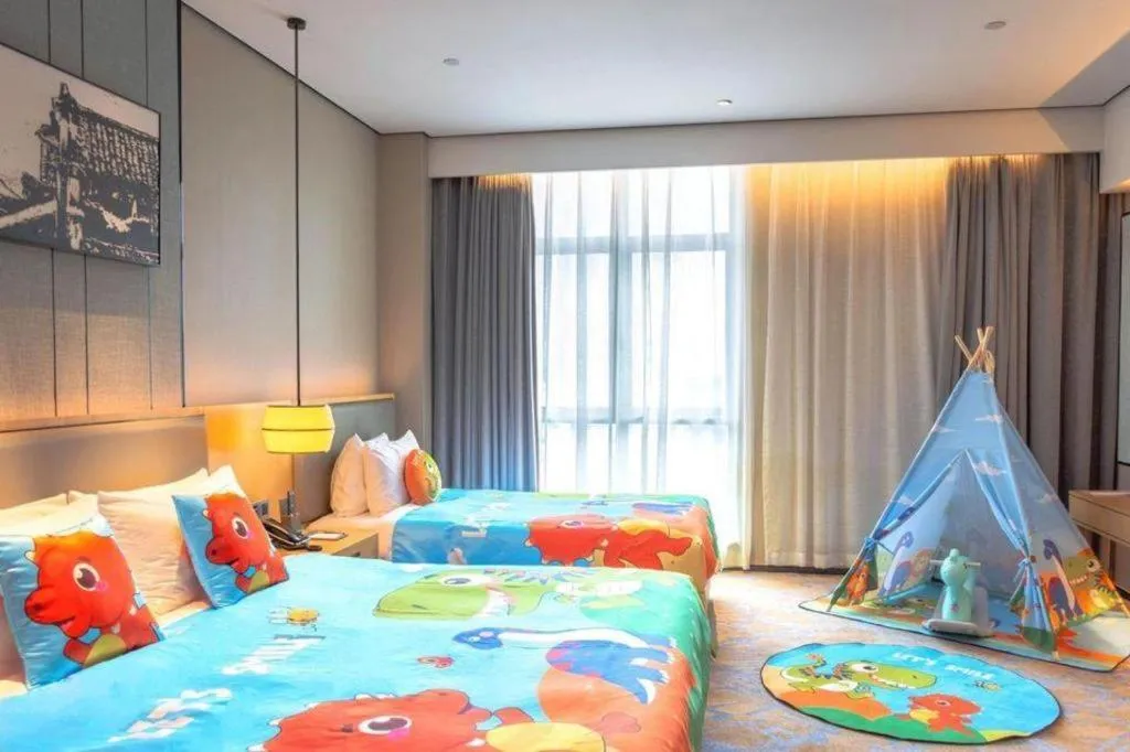 Bed in Zhuhai Tangyi Hotel