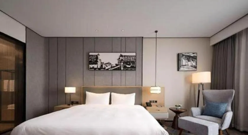 Bed in Zhuhai Tangyi Hotel