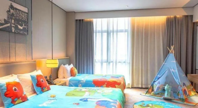 Bed in Zhuhai Tangyi Hotel