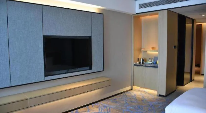 Bed in Zhuhai Tangyi Hotel