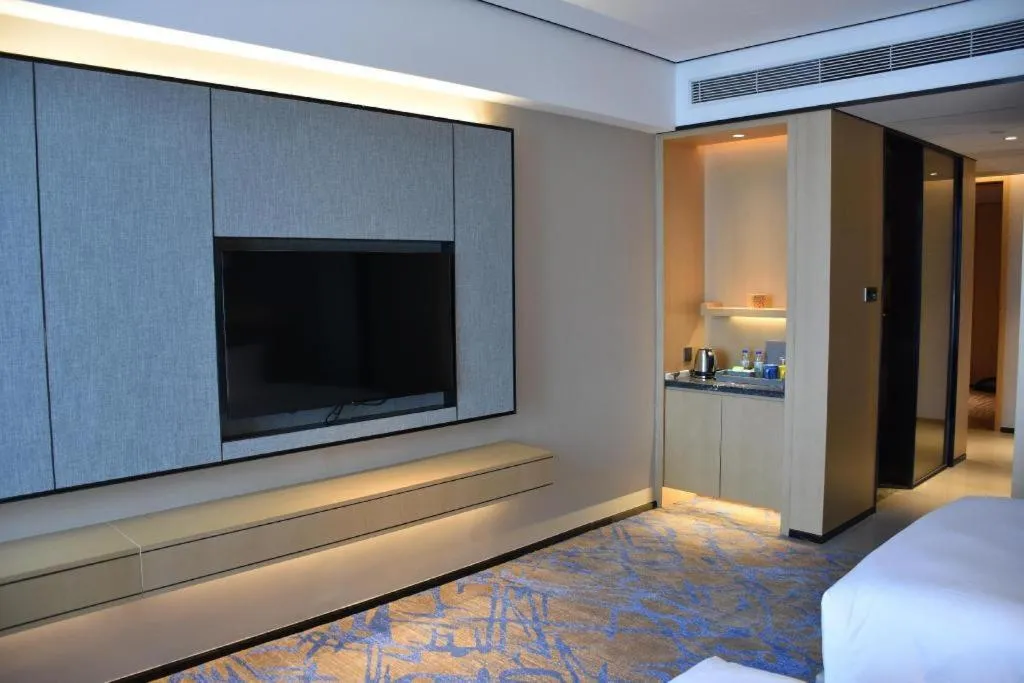 Bed in Zhuhai Tangyi Hotel