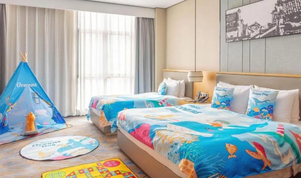 Bed in Zhuhai Tangyi Hotel