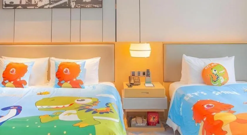 Bed in Zhuhai Tangyi Hotel