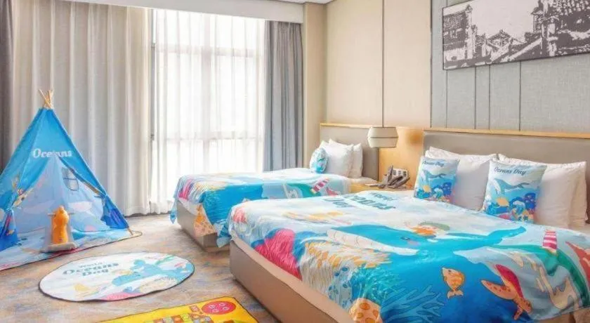 Bed in Zhuhai Tangyi Hotel