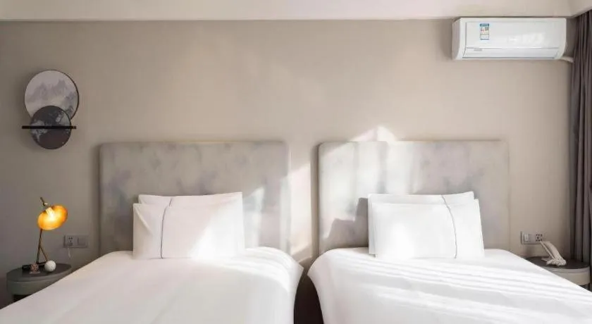 Bed in Magnotel Harbin Medical University First Affiliated Hospital