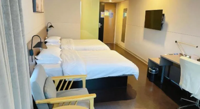 Bed in Jinjiang Inn Select Yancheng Oufeng Hua Street Julong Lake