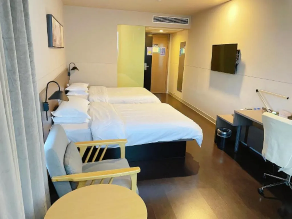 Bed in Jinjiang Inn Select Yancheng Oufeng Hua Street Julong Lake