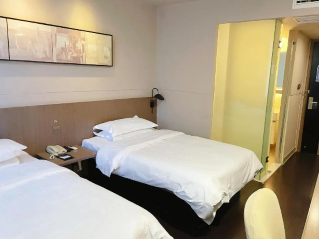 Bed in Jinjiang Inn Select Yancheng Oufeng Hua Street Julong Lake
