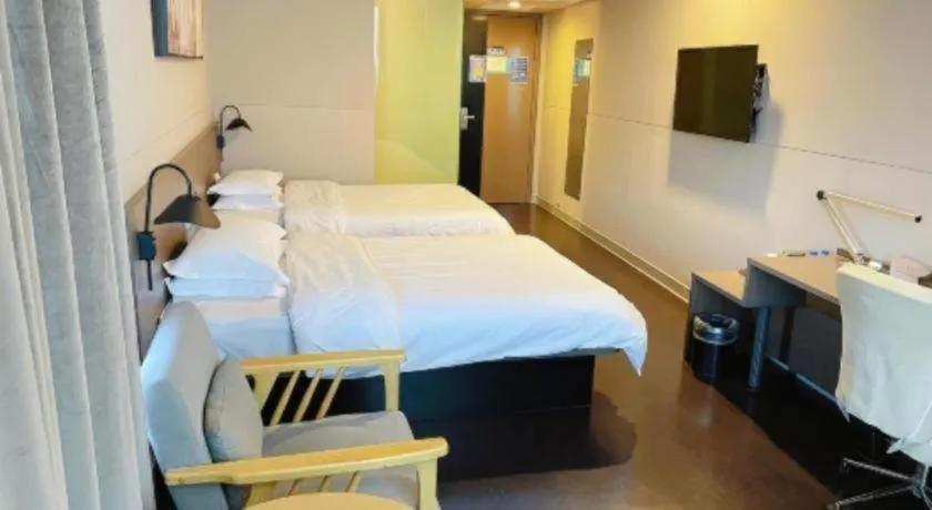 Bed in Jinjiang Inn Select Yancheng Oufeng Hua Street Julong Lake