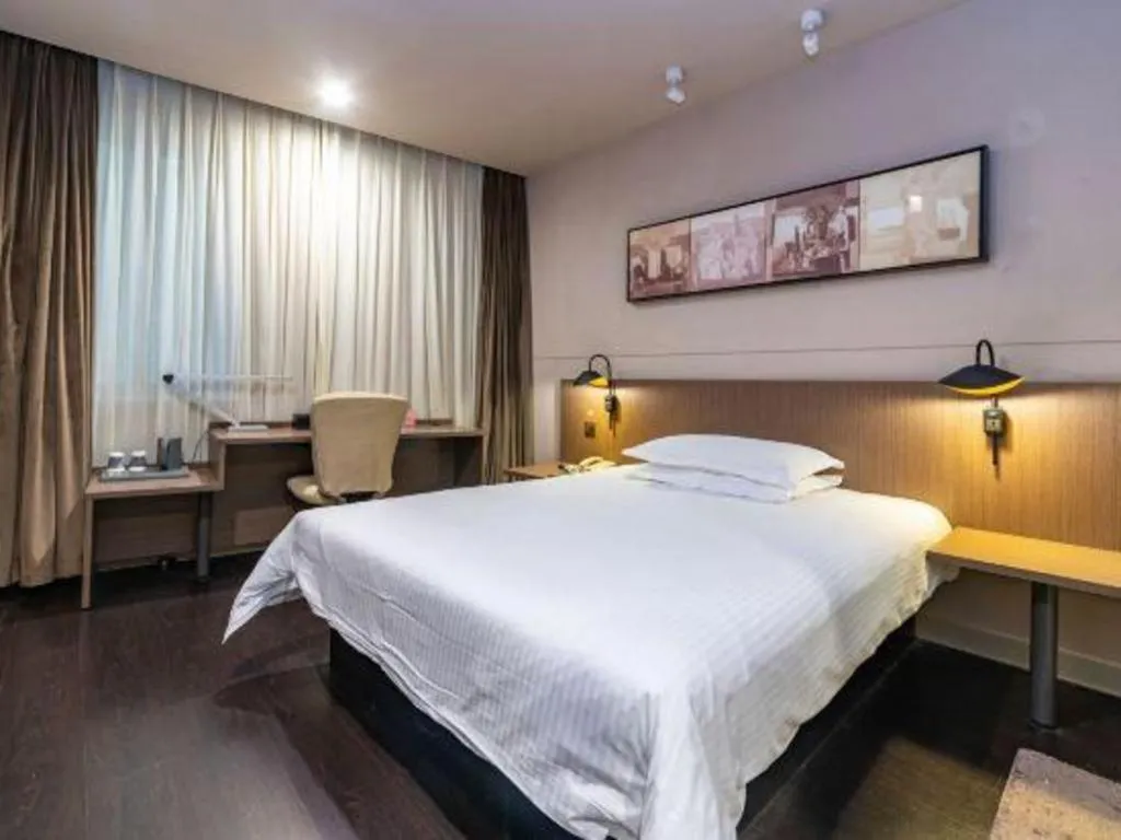 Bed in Jinjiang Inn Select Yancheng Oufeng Hua Street Julong Lake