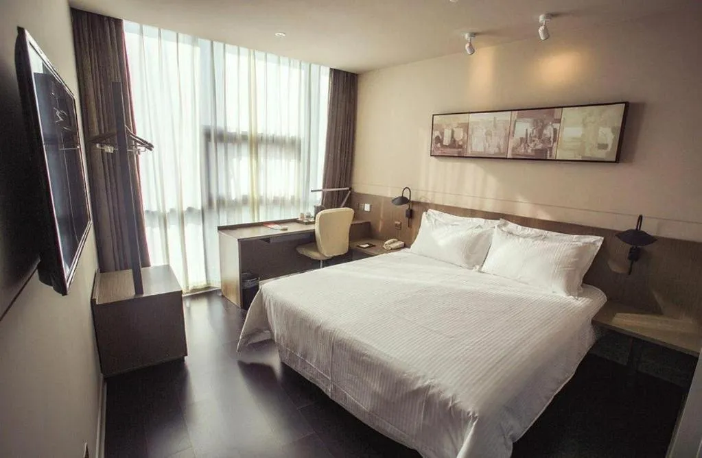 Bed in Jinjiang Inn Select Yancheng Oufeng Hua Street Julong Lake