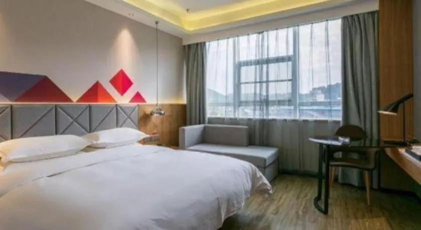 Bed in Borrman Hotel Hechi Bama Central Cultural Plaza