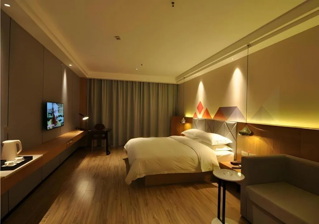 Bed in Borrman Hotel Hechi Bama Central Cultural Plaza