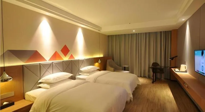 Bed in Borrman Hotel Hechi Bama Central Cultural Plaza