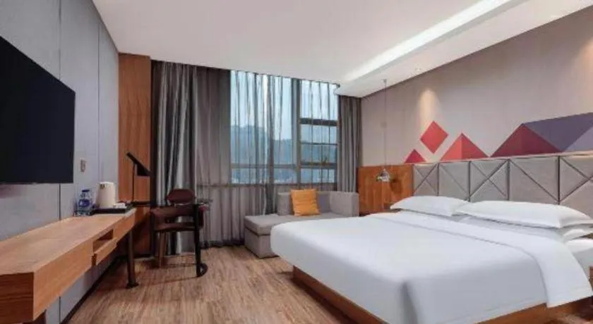 Bed in Borrman Hotel Hechi Bama Central Cultural Plaza