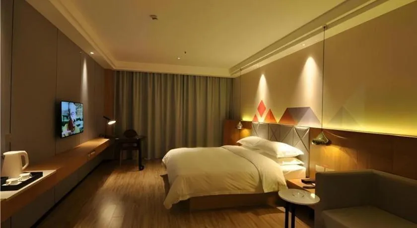 Bed in Borrman Hotel Hechi Bama Central Cultural Plaza