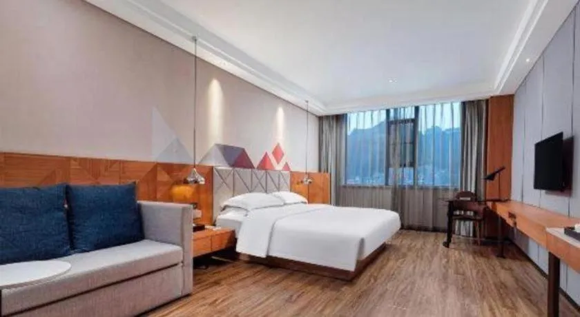 Bed in Borrman Hotel Hechi Bama Central Cultural Plaza