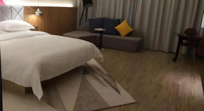 Bed in Borrman Hotel Hechi Bama Central Cultural Plaza