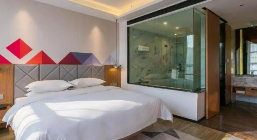 Bed in Borrman Hotel Hechi Bama Central Cultural Plaza