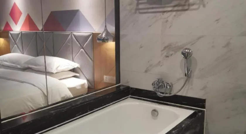 Bed in Borrman Hotel Hechi Bama Central Cultural Plaza