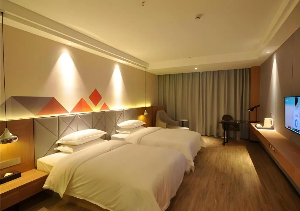 Bed in Borrman Hotel Hechi Bama Central Cultural Plaza