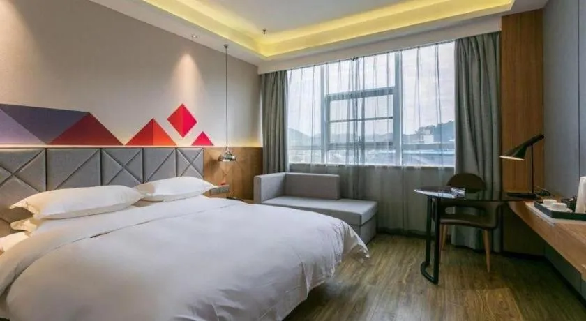 Bed in Borrman Hotel Hechi Bama Central Cultural Plaza