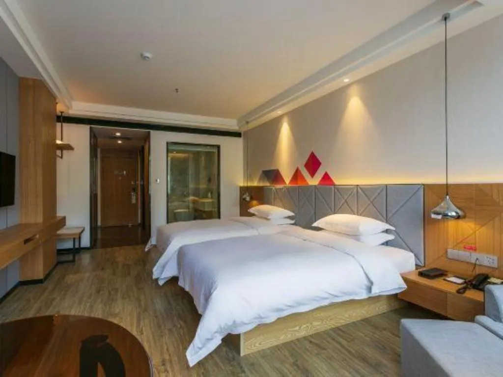 Bed in Borrman Hotel Hechi Bama Central Cultural Plaza