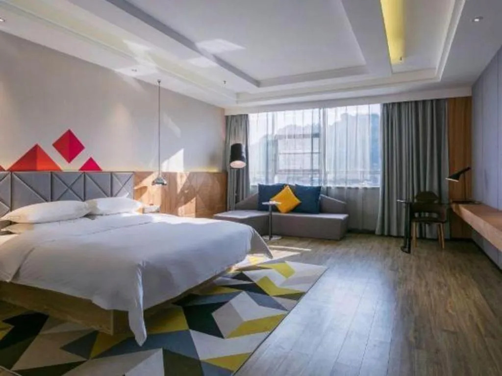 Bed in Borrman Hotel Hechi Bama Central Cultural Plaza