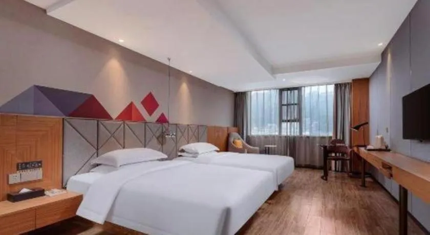 Bed in Borrman Hotel Hechi Bama Central Cultural Plaza