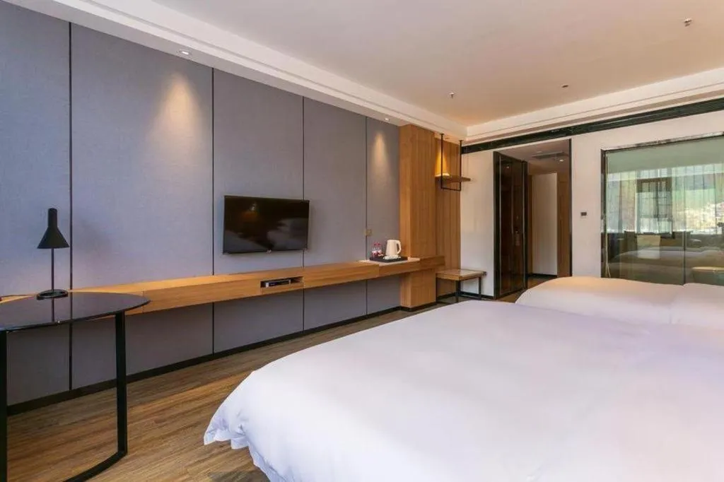 Bed in Borrman Hotel Hechi Bama Central Cultural Plaza