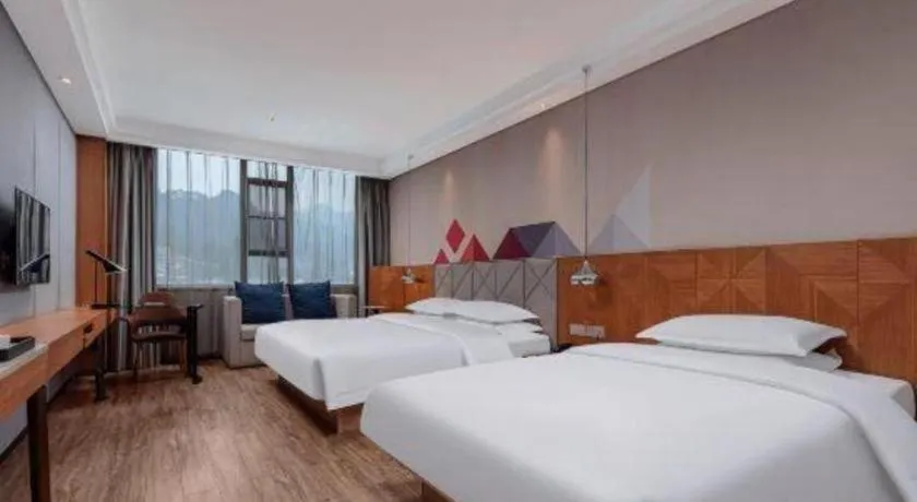 Bed in Borrman Hotel Hechi Bama Central Cultural Plaza