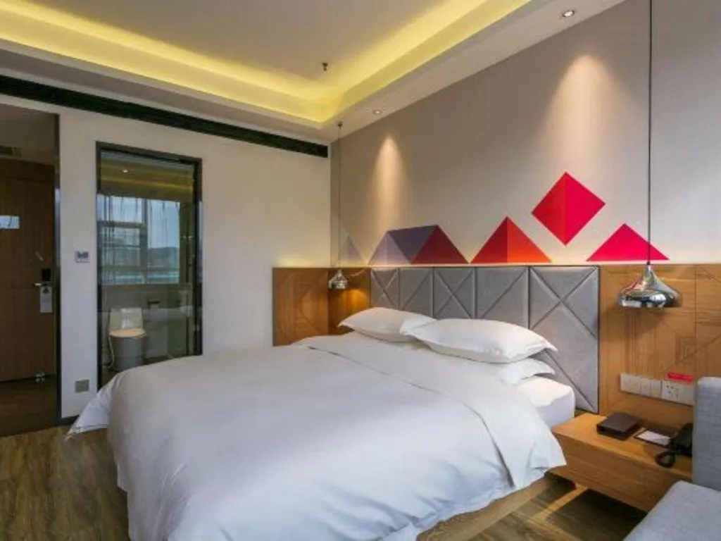 Bed in Borrman Hotel Hechi Bama Central Cultural Plaza