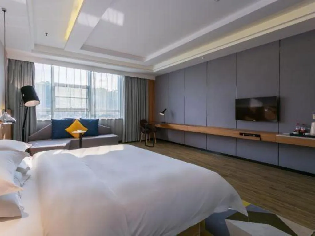 Bed in Borrman Hotel Hechi Bama Central Cultural Plaza