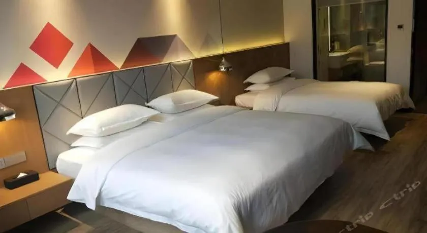 Bed in Borrman Hotel Hechi Bama Central Cultural Plaza