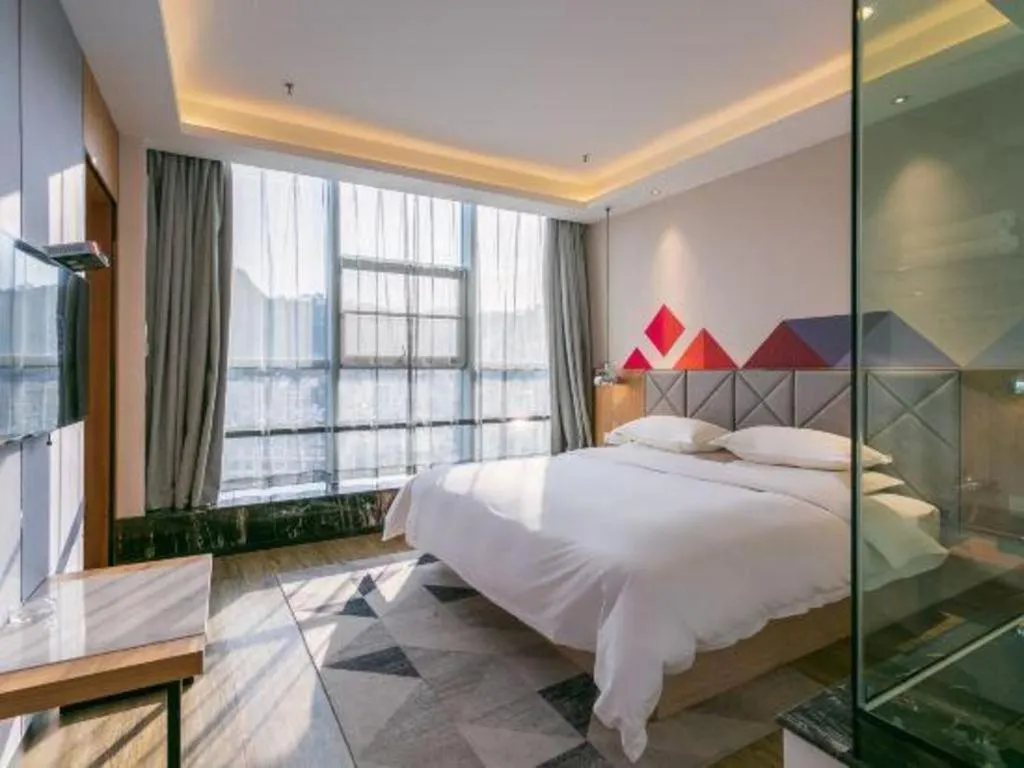 Bed in Borrman Hotel Hechi Bama Central Cultural Plaza