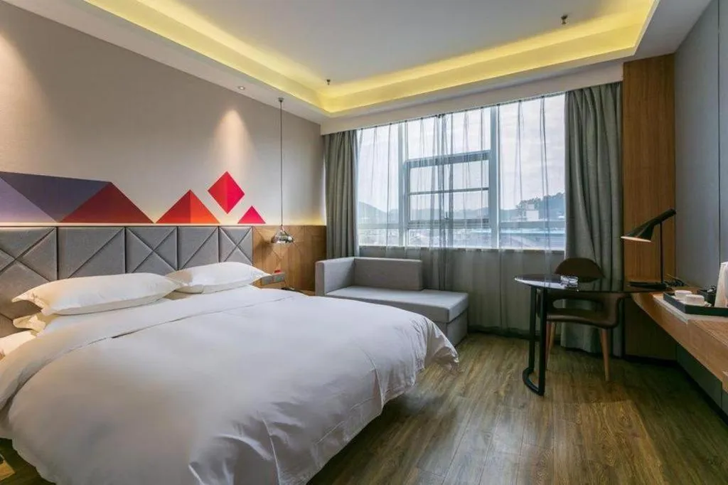 Bed in Borrman Hotel Hechi Bama Central Cultural Plaza