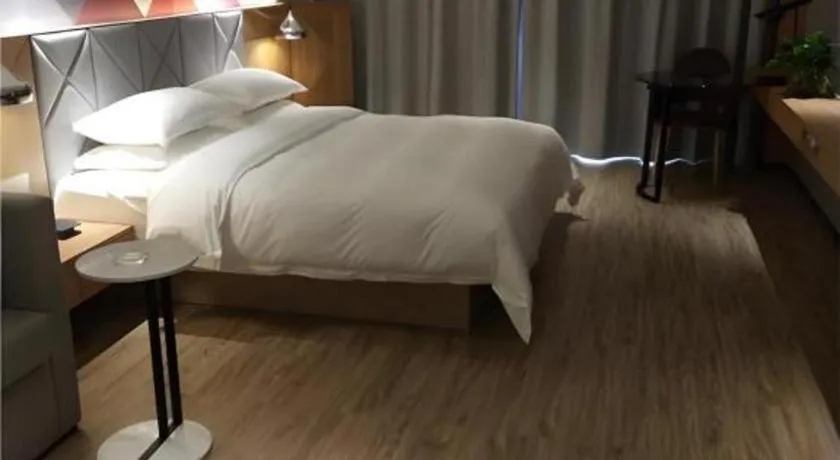 Bed in Borrman Hotel Hechi Bama Central Cultural Plaza