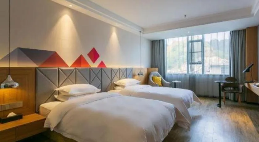 Bed in Borrman Hotel Hechi Bama Central Cultural Plaza