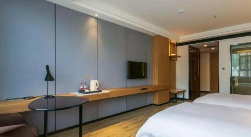 Bed in Borrman Hotel Hechi Bama Central Cultural Plaza