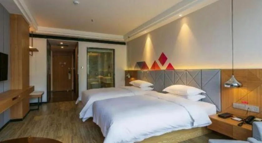 Bed in Borrman Hotel Hechi Bama Central Cultural Plaza