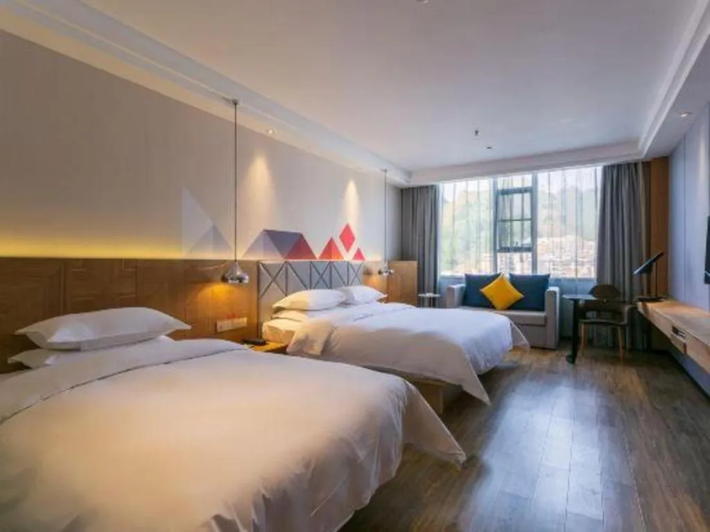 Bed in Borrman Hotel Hechi Bama Central Cultural Plaza