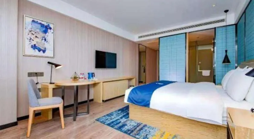 Bed in Echarm Hotel Xiantao Yuantai Weilaicheng