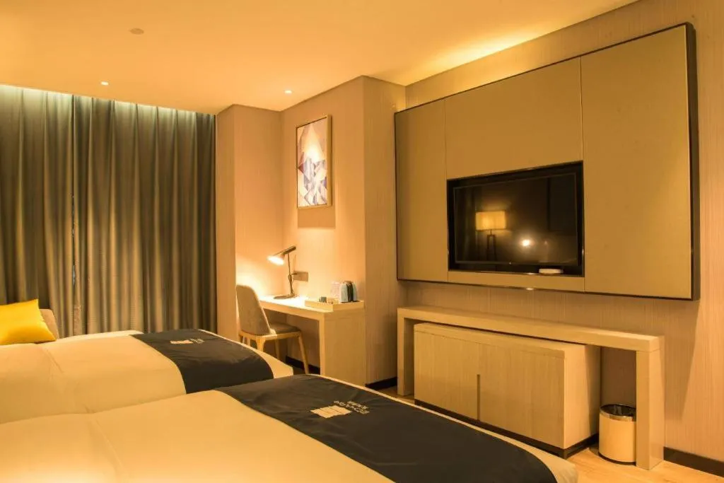 Bed in Echarm Hotel Xiantao Yuantai Weilaicheng