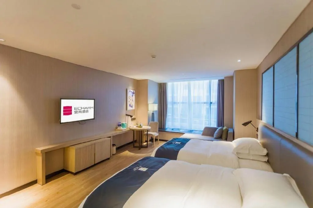 Bed in Echarm Hotel Xiantao Yuantai Weilaicheng