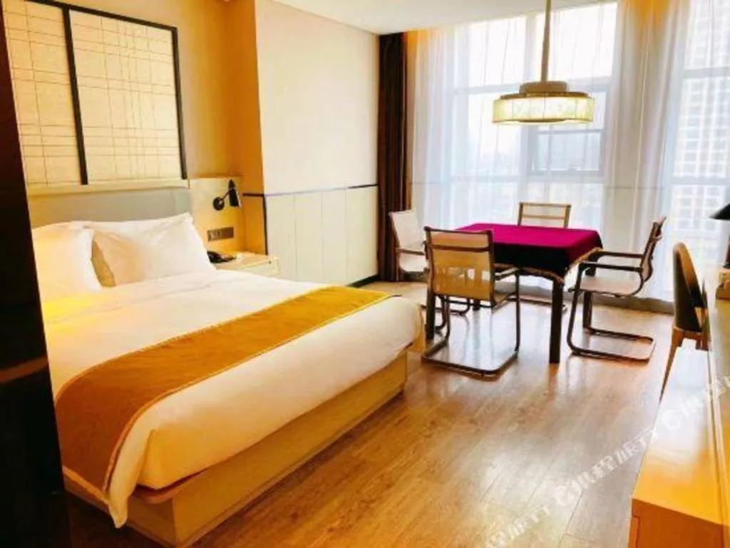 Bed in Echarm Hotel Xiantao Yuantai Weilaicheng