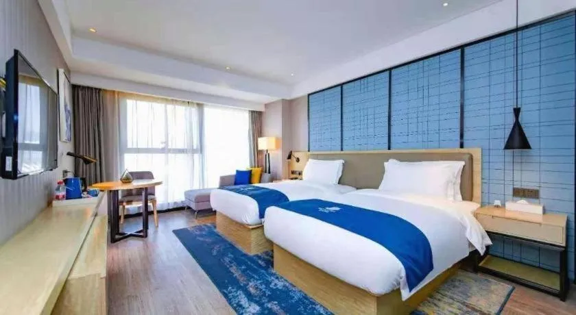 Bed in Echarm Hotel Xiantao Yuantai Weilaicheng