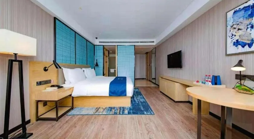 Bed in Echarm Hotel Xiantao Yuantai Weilaicheng