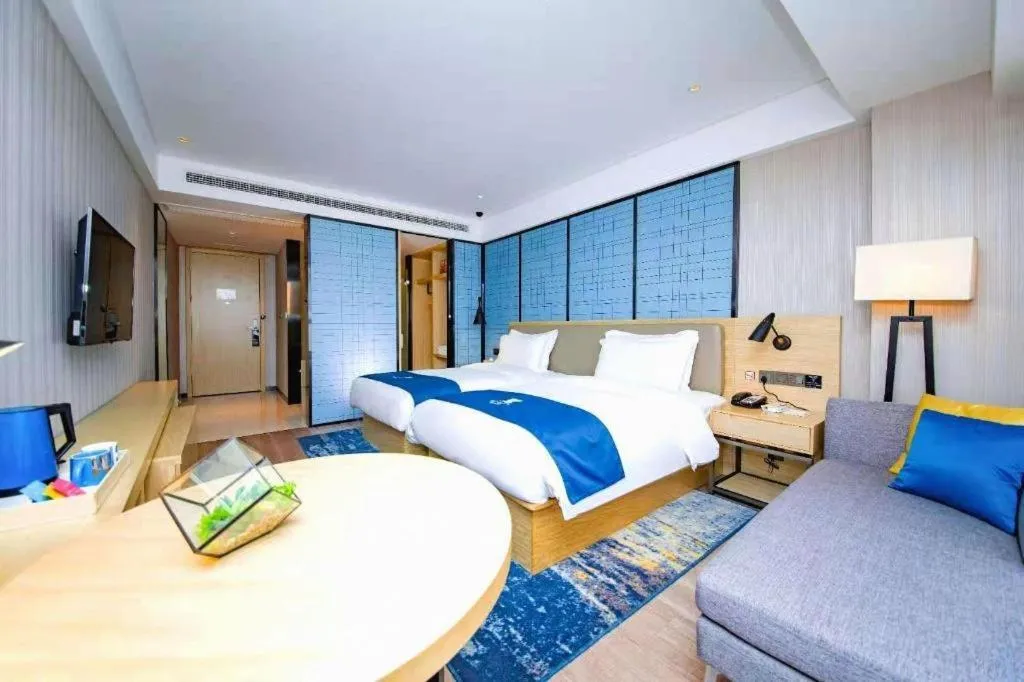 Bed in Echarm Hotel Xiantao Yuantai Weilaicheng