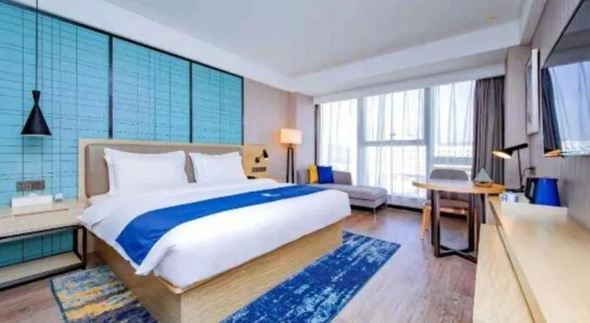 Bed in Echarm Hotel Xiantao Yuantai Weilaicheng