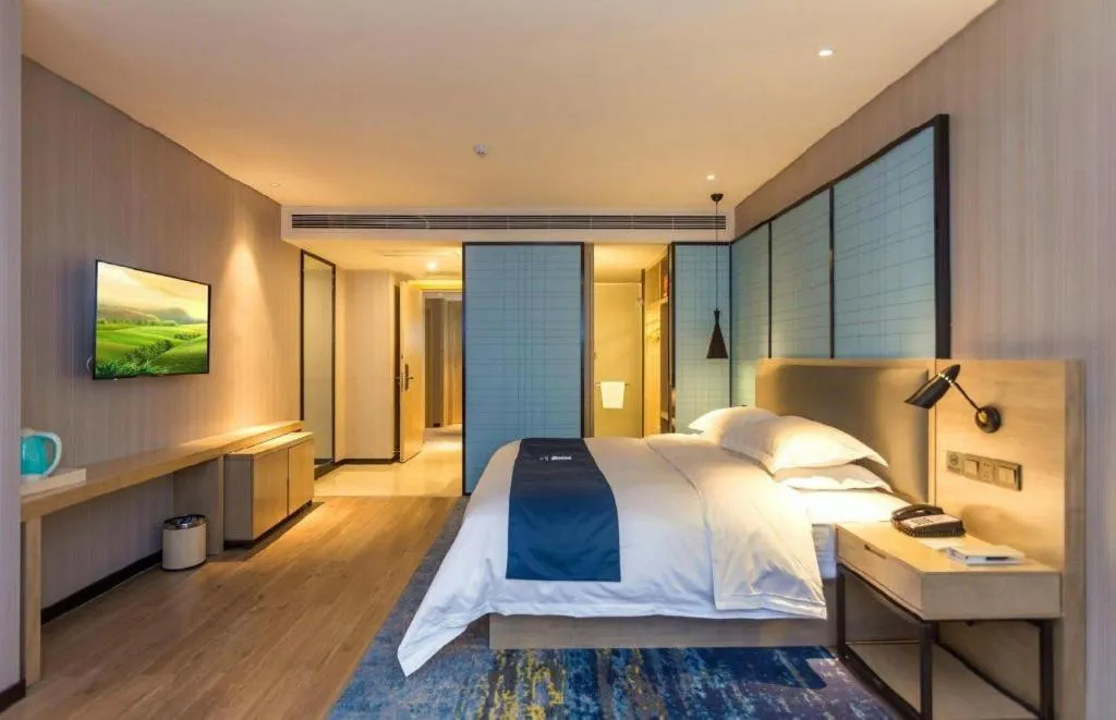 Bed in Echarm Hotel Xiantao Yuantai Weilaicheng